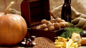 Still life with chest, nuts, pumpkin, bread and pasta